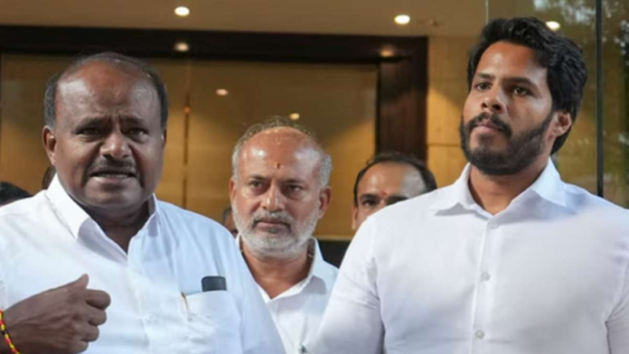 Union Minister HD Kumaraswamy and his son Nikhil Kumaraswamy