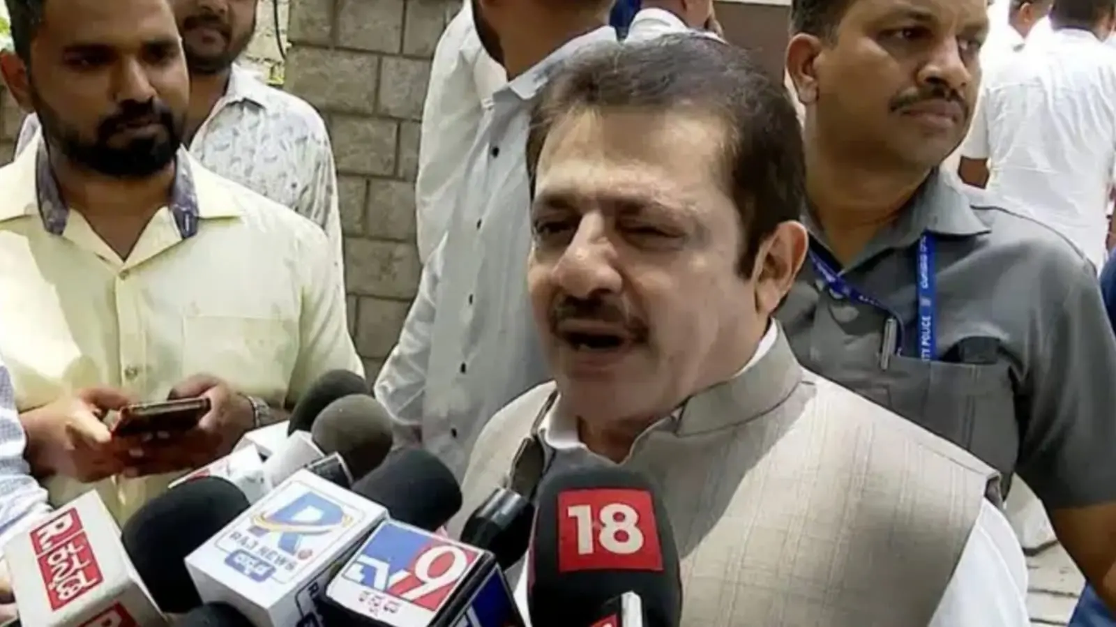 Congress leader Zameer Ahmed giving a press statement in Bengaluru.